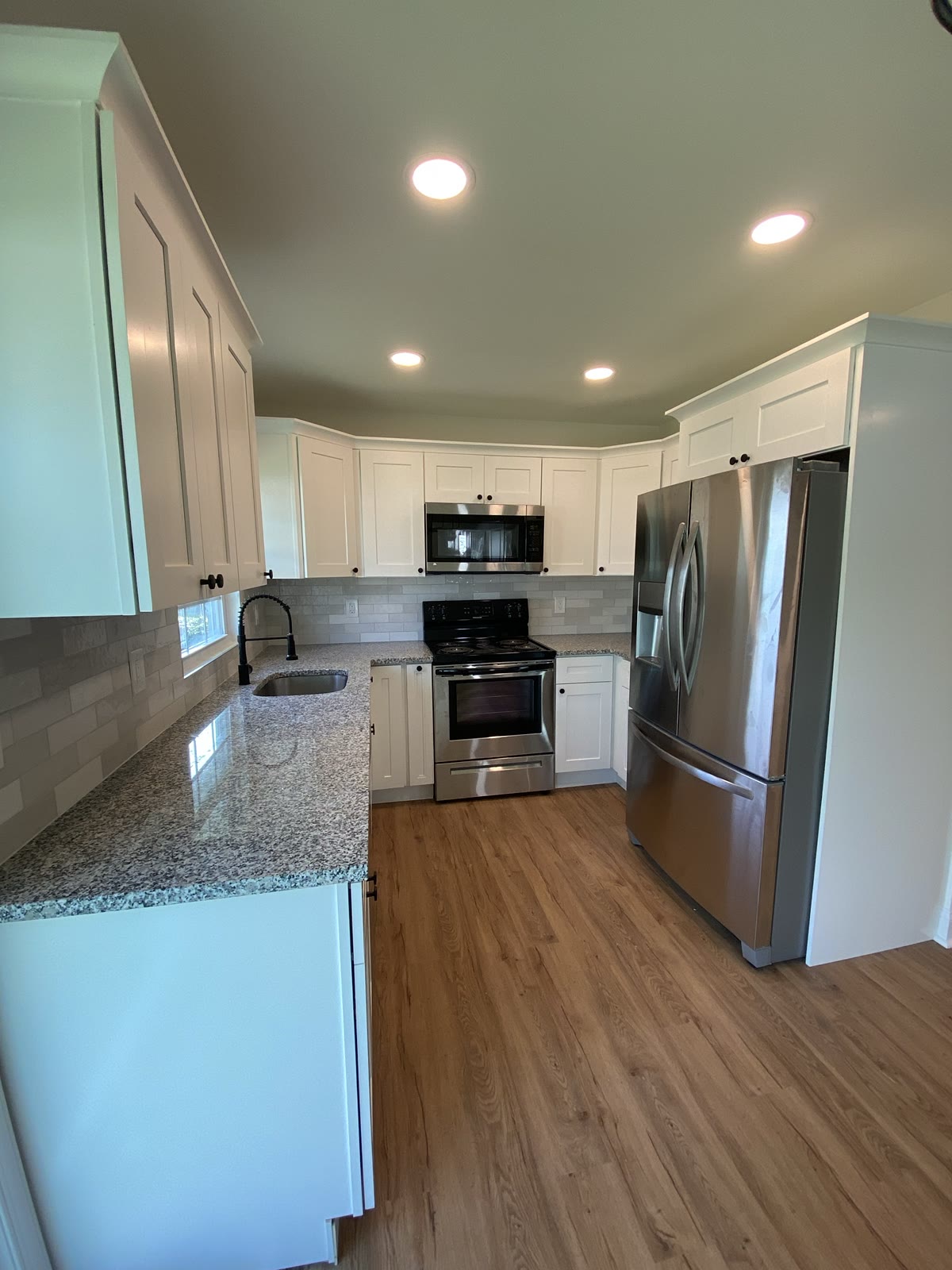 Kitchen remodel with white shaker cabinets, granite counters and subway backsplash, Levittown
