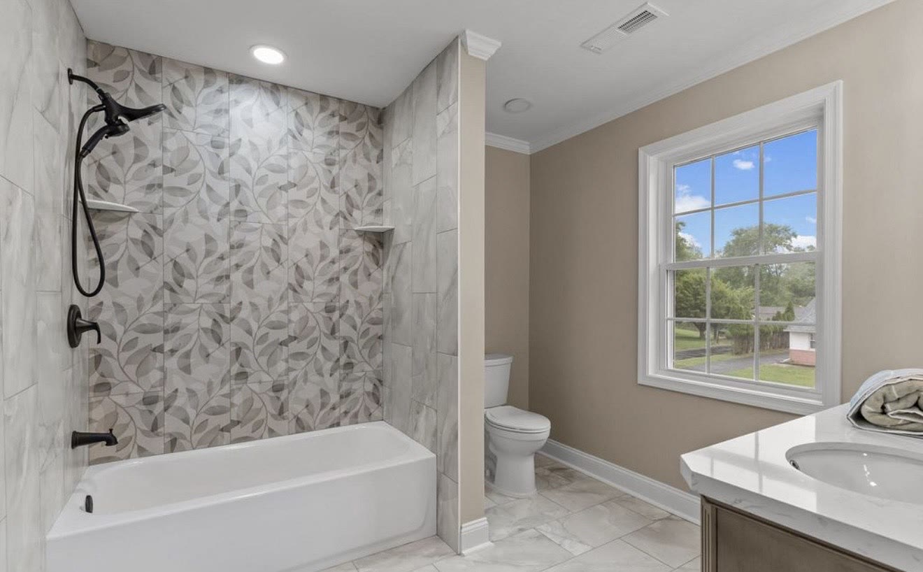Full bathroom remodel with custom tile tub surround