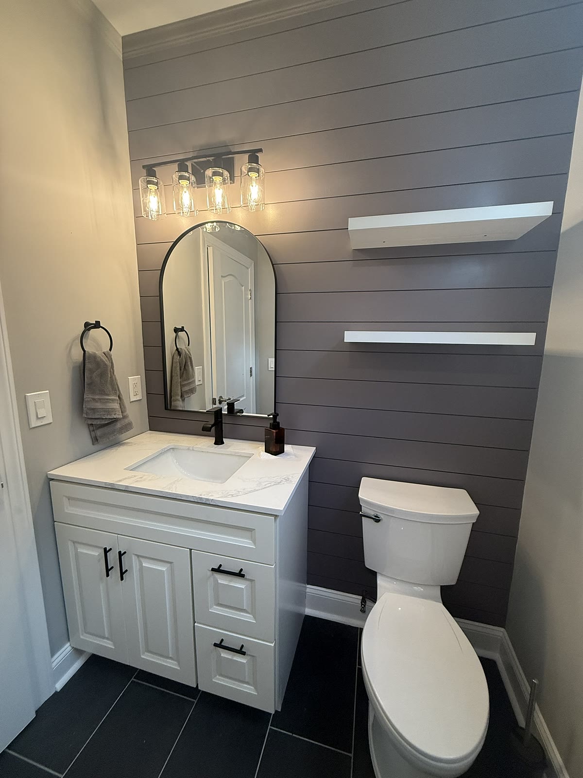 Powder room remodel with shiplap accent wall and arched mirror, Newtown